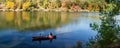 Couple Canoeing on Peaceful Mountain Lake Royalty Free Stock Photo